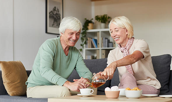 Freepik_senior-couple-sitting-on-sofa-and-drinking-tea-together-in-the-living-room_annastills.jpg