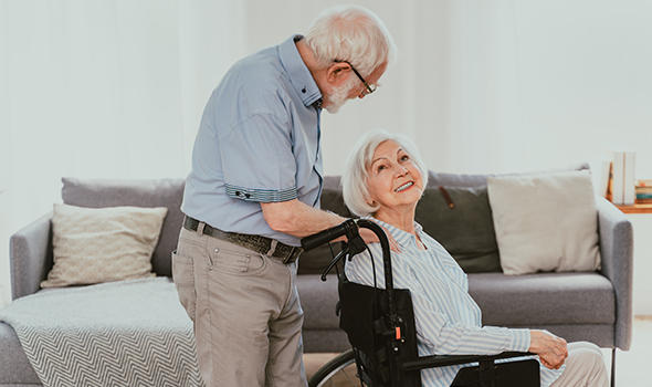 Freepik_disabled-old-man-on-wheel-chair-senior-couple-at-home-partner-coming-back-from-hospital_oneinchpunch_590x350.jpg