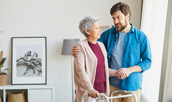 Freepik_senior-woman-using-walker-and-talking-to-her-caregiver-he-helping-her-during-rehabilitation_annastills.jpg