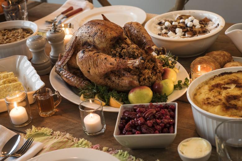 Dining-table-filled-with-thanksgiving-food.jpg