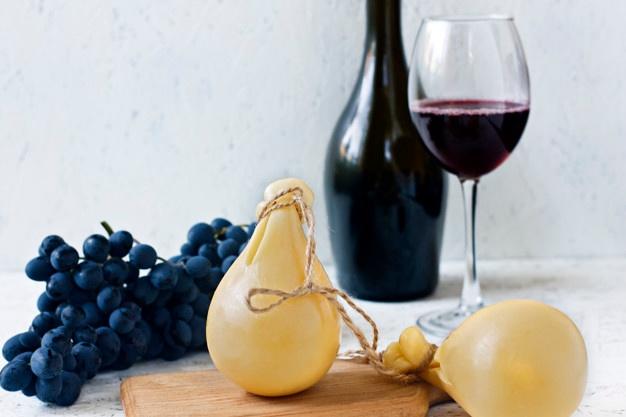 cheese-caciocavallo-glass-bottle-red-wine-grapes-cheese-pear_74197-264.jpg