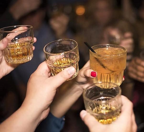 alcohol-whiskey-drink-party-people-cheers-salute-friends-night.jpg